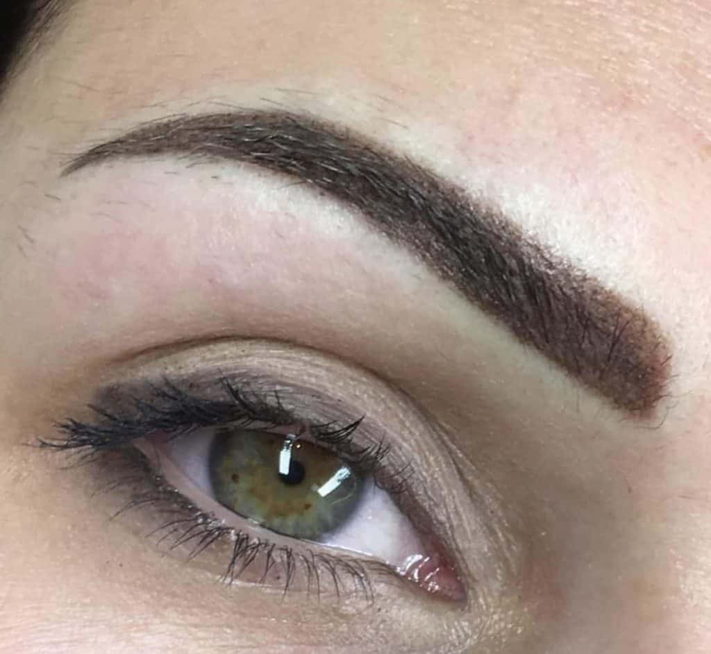 A woman after her first microblading session.