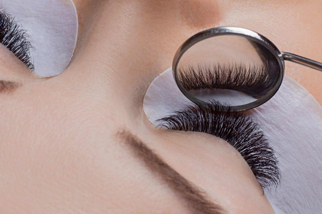 Lash Application Process - A woman getting volume lash extensions in Oakville, ON.