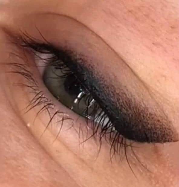 A woman with a permanent winged eyeliner.