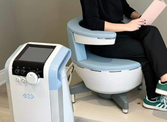 Woman enjoying a Kegel Throne treatment in a luxurious spa setting